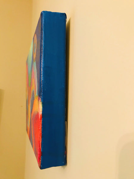 Edges painted with blues to match the painting.